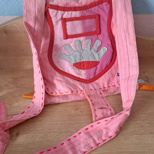Cloth bag with doll and clothes used