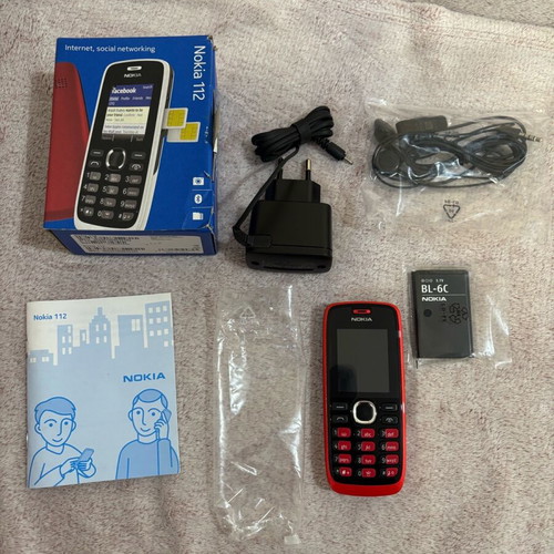 Nokia 112 unused mobile phone in box with battery, charger and headphones