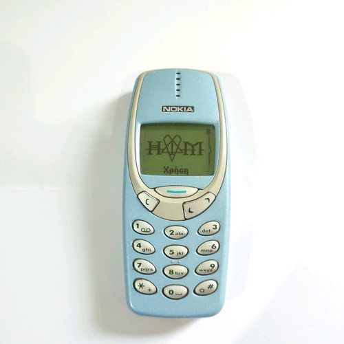 Nokia 3330 phone used with charger and buttons