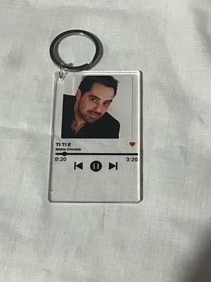 Makis Dimakis keychain new, plastic, black and white