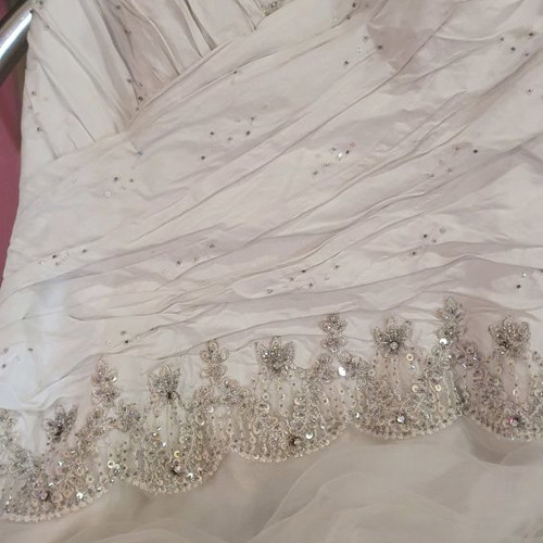 Wedding dress new, designer piece from London in ice color with embroidery