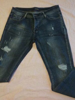 Blue jeans with distressed design, size XL, like new