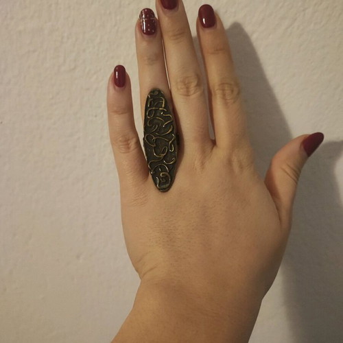Ring with embossed designs adjustable size, like new
