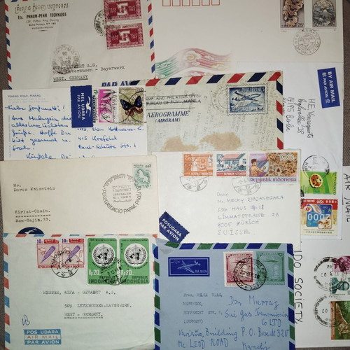 Collection of envelopes and stamps from around the world, new