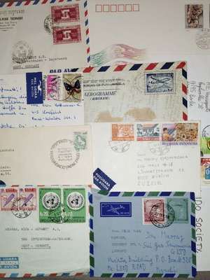 Collection of envelopes and stamps from around the world, new