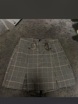 Skort used black and white plaid with silver buckles and pink detail