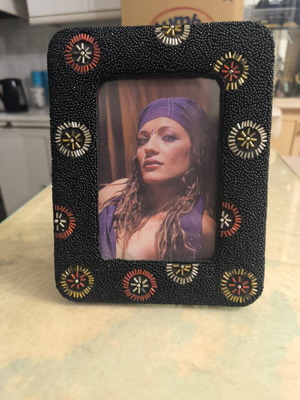 Black photo frame with colorful decorative designs like new