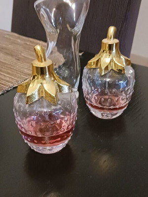 Various perfume bottles used, two with strawberry scent