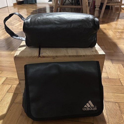 Two black leather toiletry bags, one Adidas