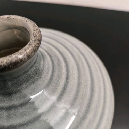 Ceramic low vase in gray shades like new