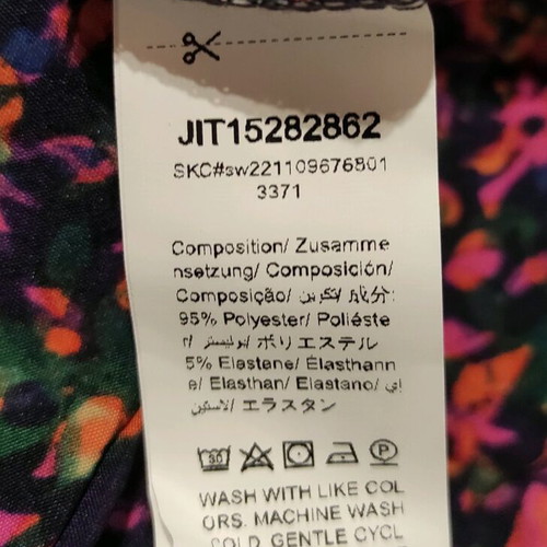 Women's blouse Medium like new, multicolor with elastic cuffs and button