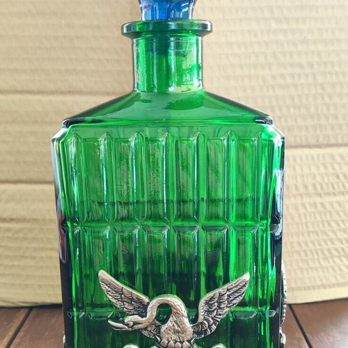 Vintage Italian glass bottle in metal base like new