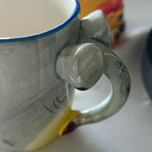 Children's ceramic mugs used, vintage with embossed elephant and lion