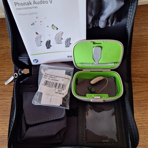 Phonak Audéo V hearing aid with case and cleaning accessories