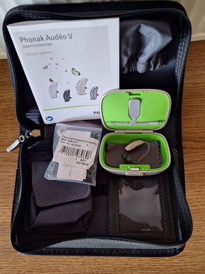 Phonak Audéo V hearing aid with case and cleaning accessories