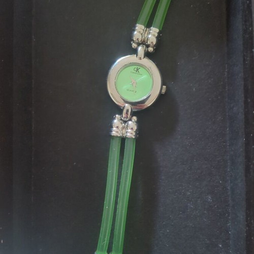 Calvin Klein wristwatch used, green and silver