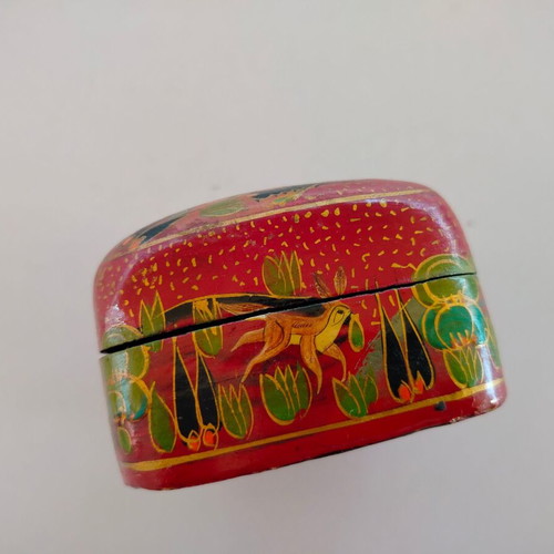 Decorative papier-mache box used with colorful patterns