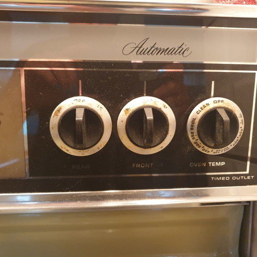 Vintage 1970s home appliance set used, General Electric fridge, Kenmore stove, Ariston washer