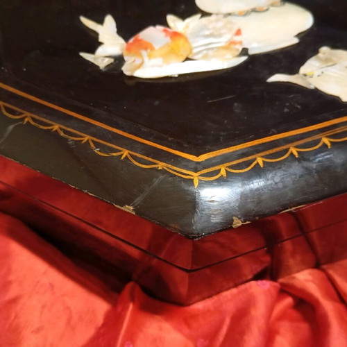 Wooden octagonal box used with shell decoration and red lacquer interior