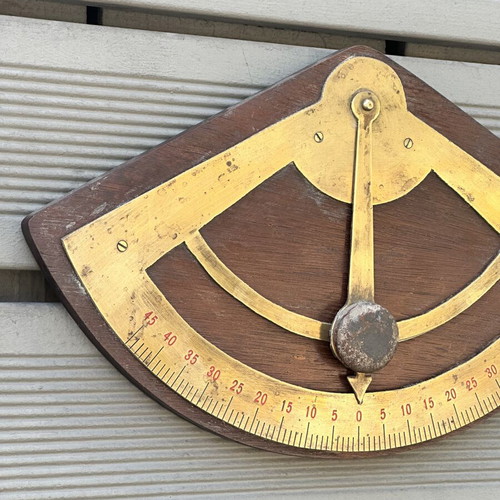 Vintage wooden wall protractor with brass details, used