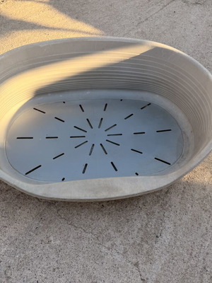 Large plastic dog bed used, outdoor weatherproof