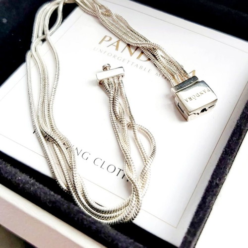 Pandora s925Ale Reflexions bracelet with four strands.
