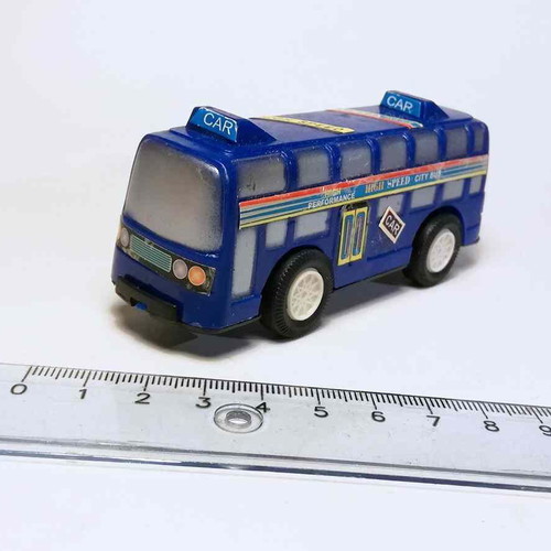 Plastic toy bus used with scratches and marks