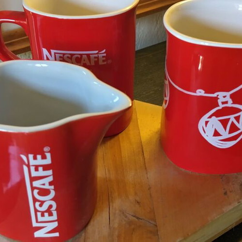Collectible Nescafé cups and milk jug like new