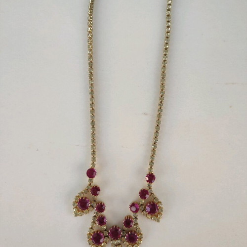 Antique necklace used with pink stones and gold rhinestones