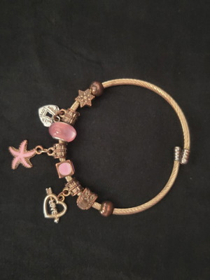 Women's bracelet type bangle with pink and silver charms like new