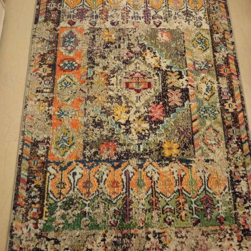 Colorful oriental style rug with distressed look like new