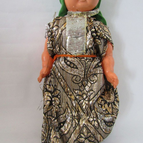 Vintage souvenir doll with traditional oriental costume used