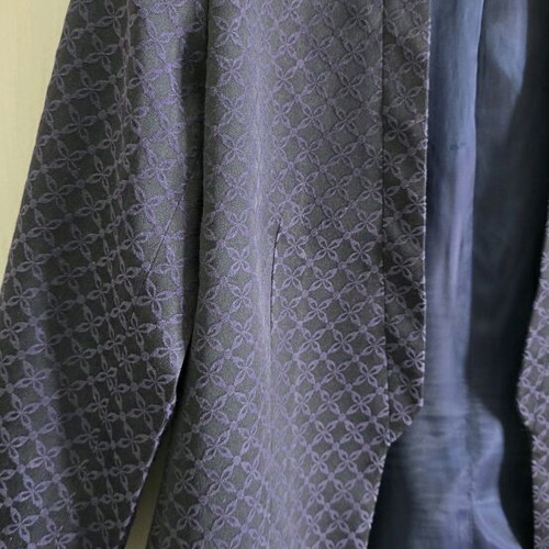 Black H&M jacket with three-quarter sleeve and purple embroidery size medium like new