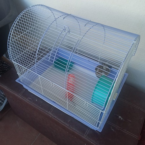 Hamster cage used, with cleaning drawer
