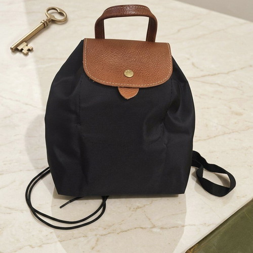 Smart foldable backpack like new, black with brown details