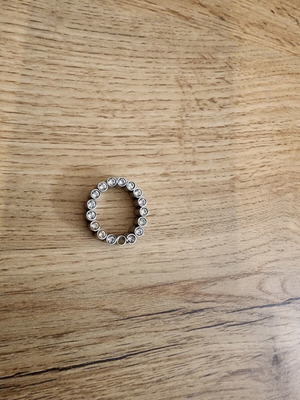 Silver toned bezel-set eternity band ring like new