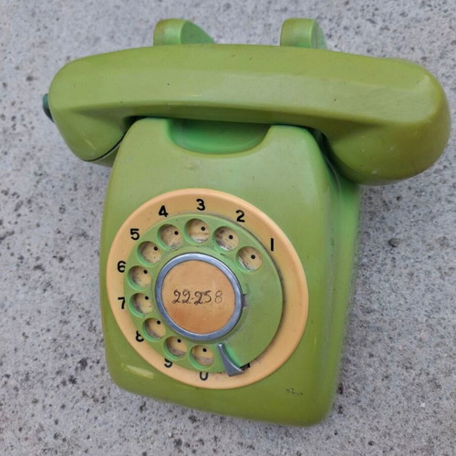 Vintage green rotary dial telephone used