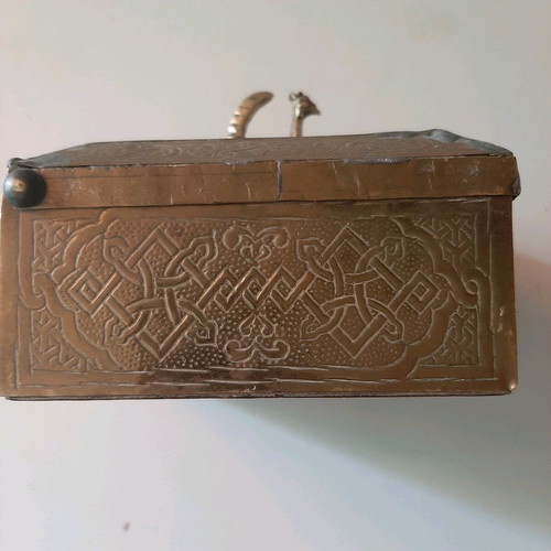 Oriental copper box used with carved decorations