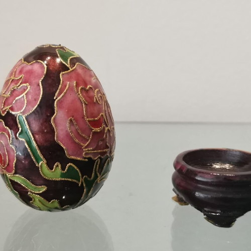 Cloisonne egg used with pink flowers and wooden base