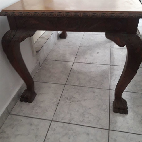 Antique dining table with lion feet