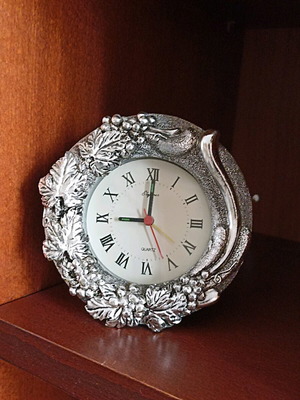 Vintage collectible quartz table clock used, silver carved design