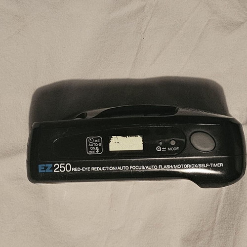 Vivitar 35mm EZ250 camera used with flash and red eye reduction