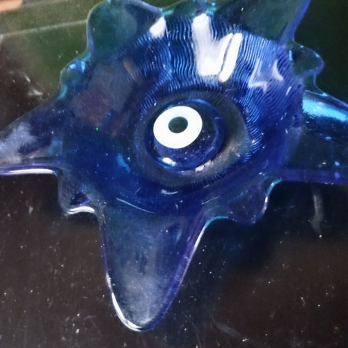 Star-shaped glass ashtray used, decorative
