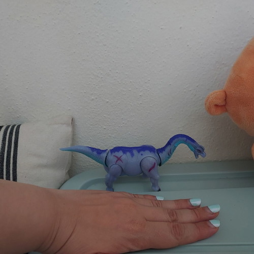 Dinosaur toy like new, purple with movable head and tail