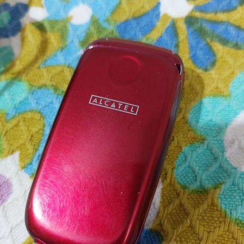 Alcatel vintage flip phone used, red, charger included