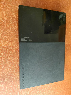 PlayStation 2 Slim used, black console without cables or controller