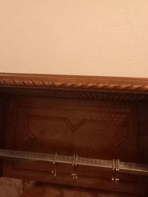 Antique handmade wooden coat rack with wicker lining used