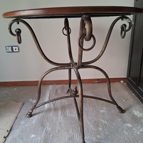 Rotunda table like new with heavy brass base and wooden top