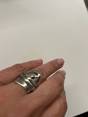 Silver ring vintage by renowned designer, like new with mask design