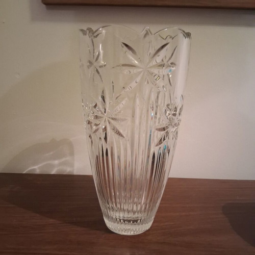 Vintage crystal vase with embossed stars and daisies used